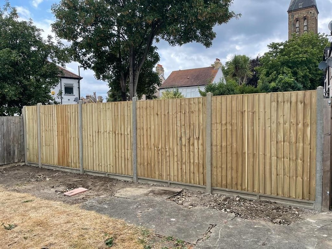 New wooden fence and post installation